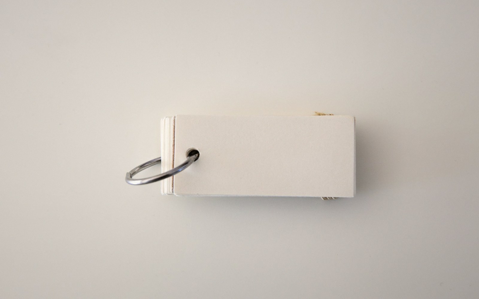 Small stack of blank cards bound together with a metal ring