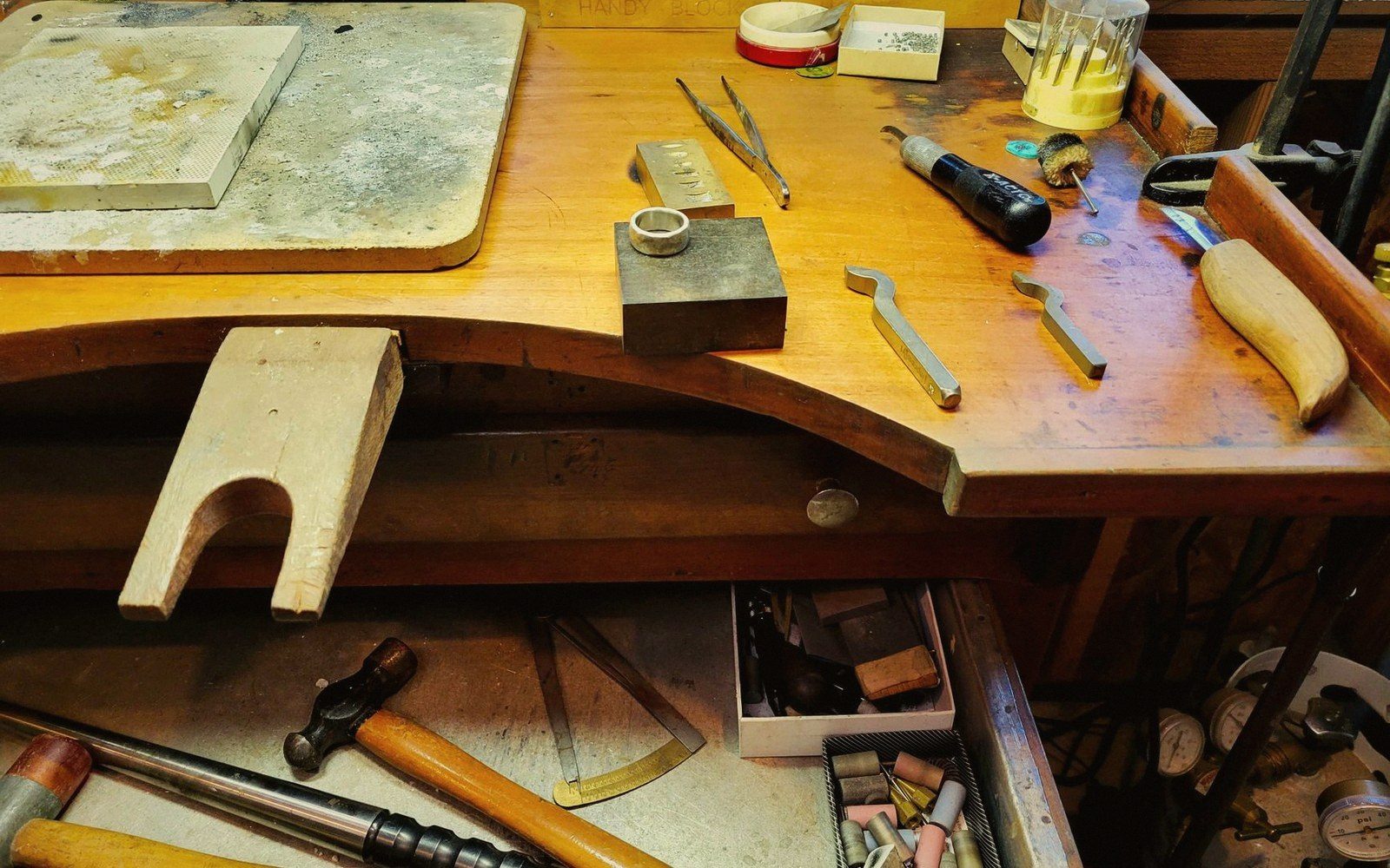 A jeweller's bench with a ring in a setting clamp